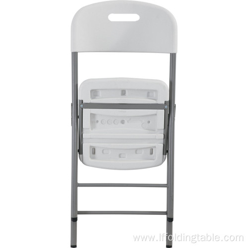 White plastic folding chair